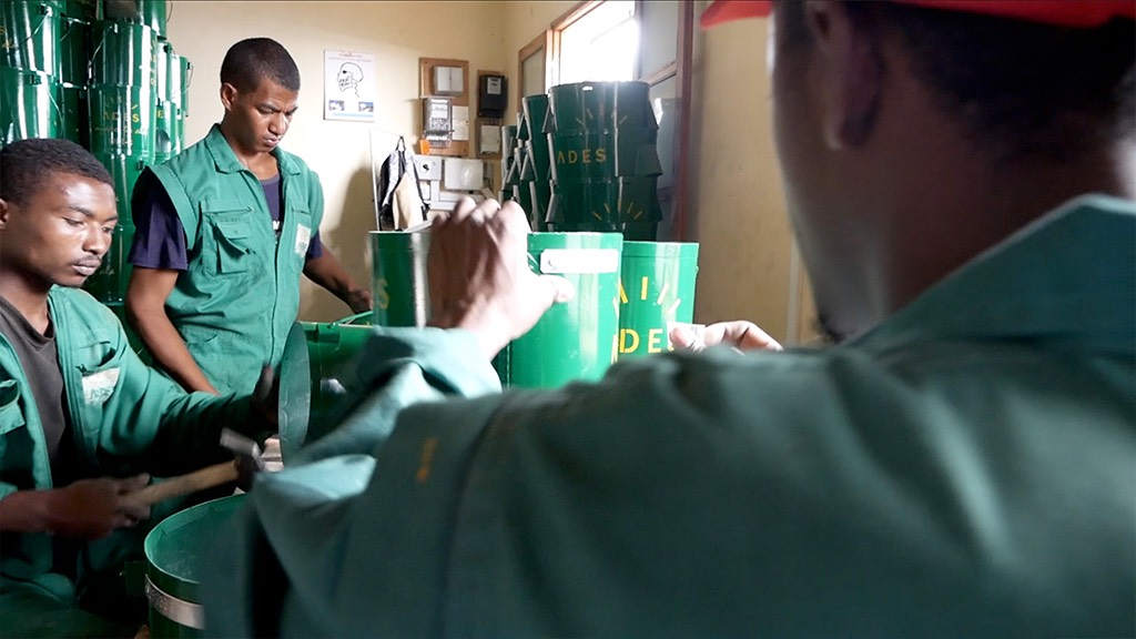 a group of men working in a green room.