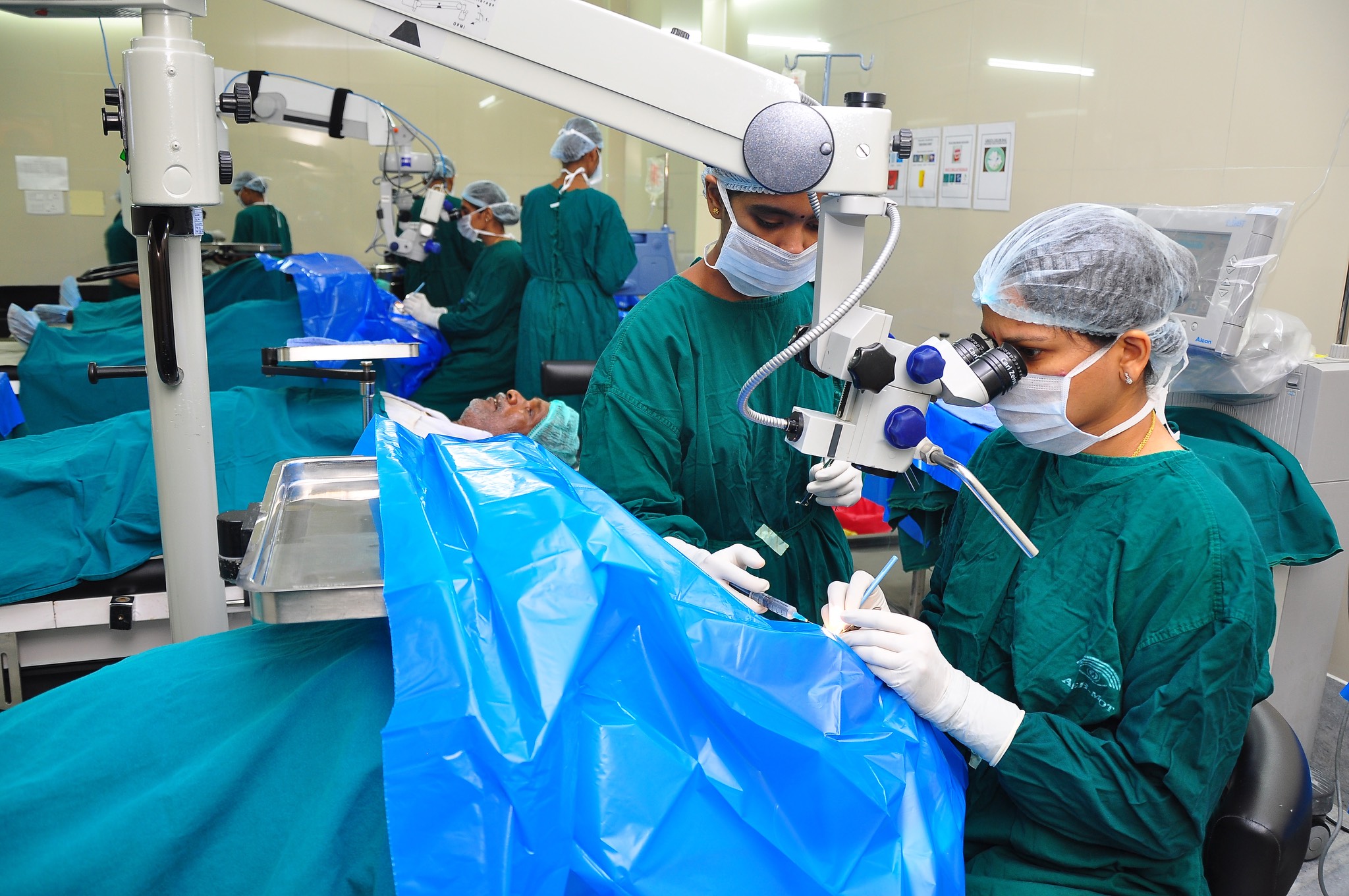 a group of surgeons working in an operating room.