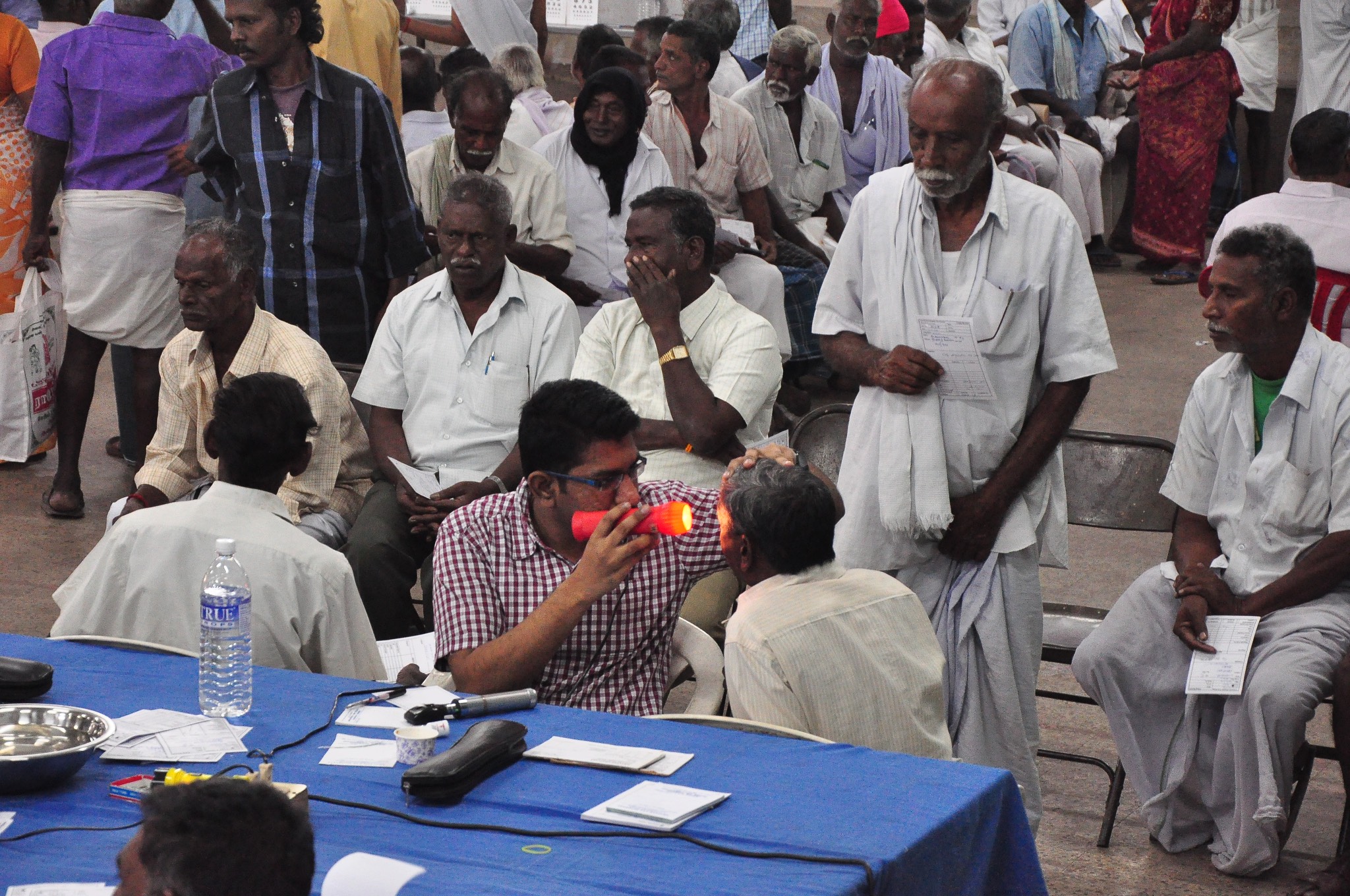a group of people sitting around a table.