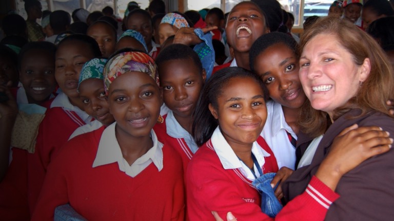 a group of school children posing for a photo.