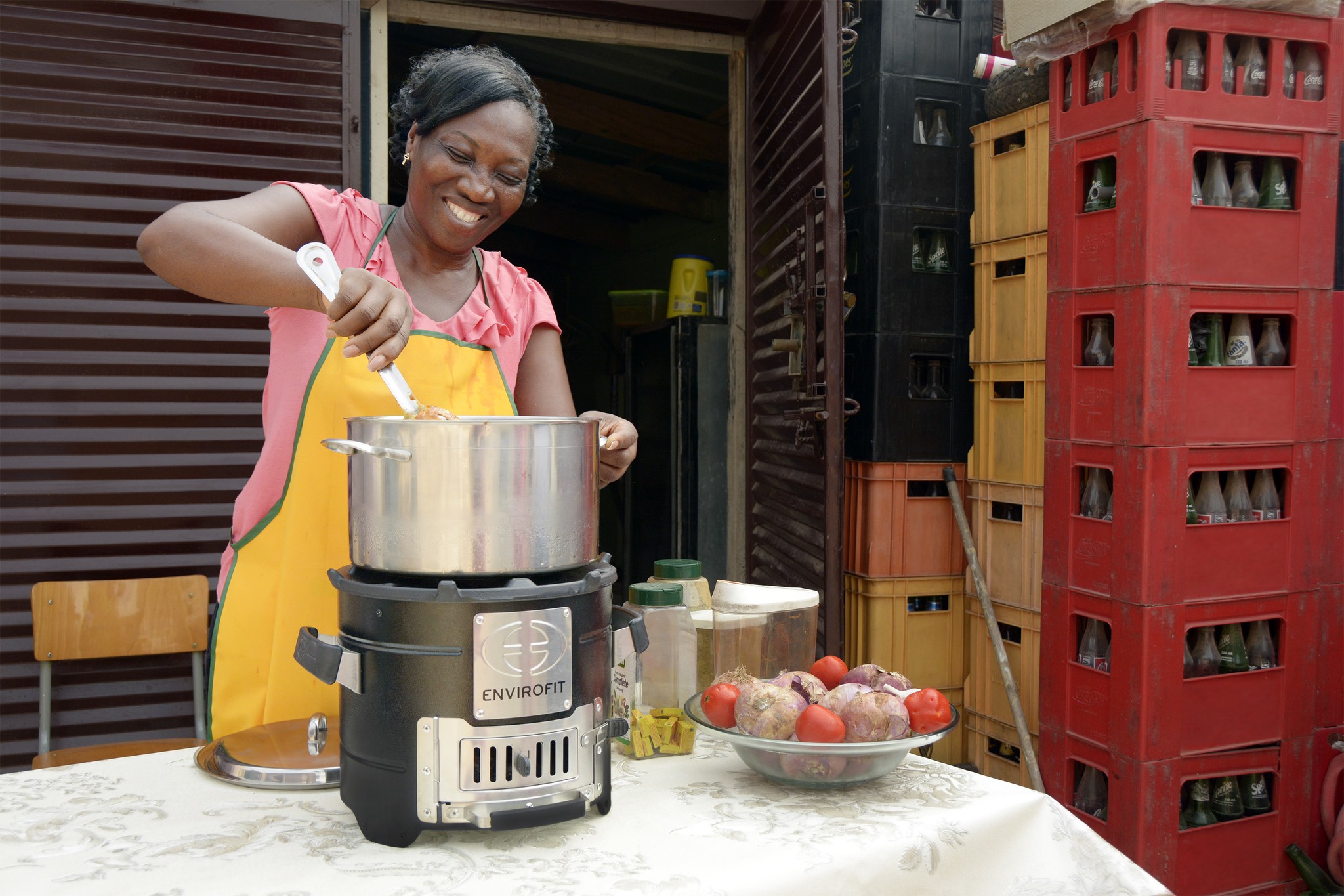 a woman wearing a yellow apron.